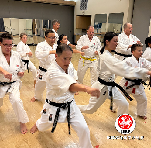 ISKF Colorado students in synchronized karate training with Sensei Ryu leading the class